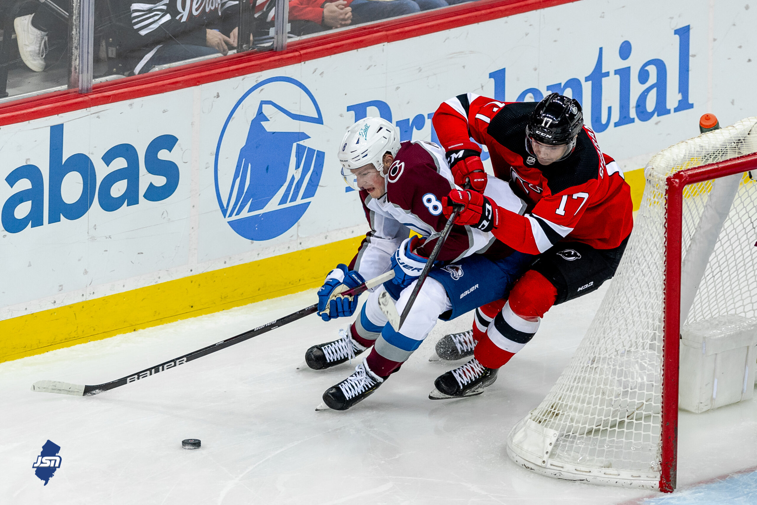 New Jersey Devils' Jack Hughes bleeding on the bench after getting