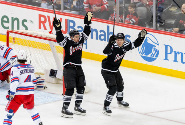The New Jersey Devils celebrate a goal against the New York Rangers.